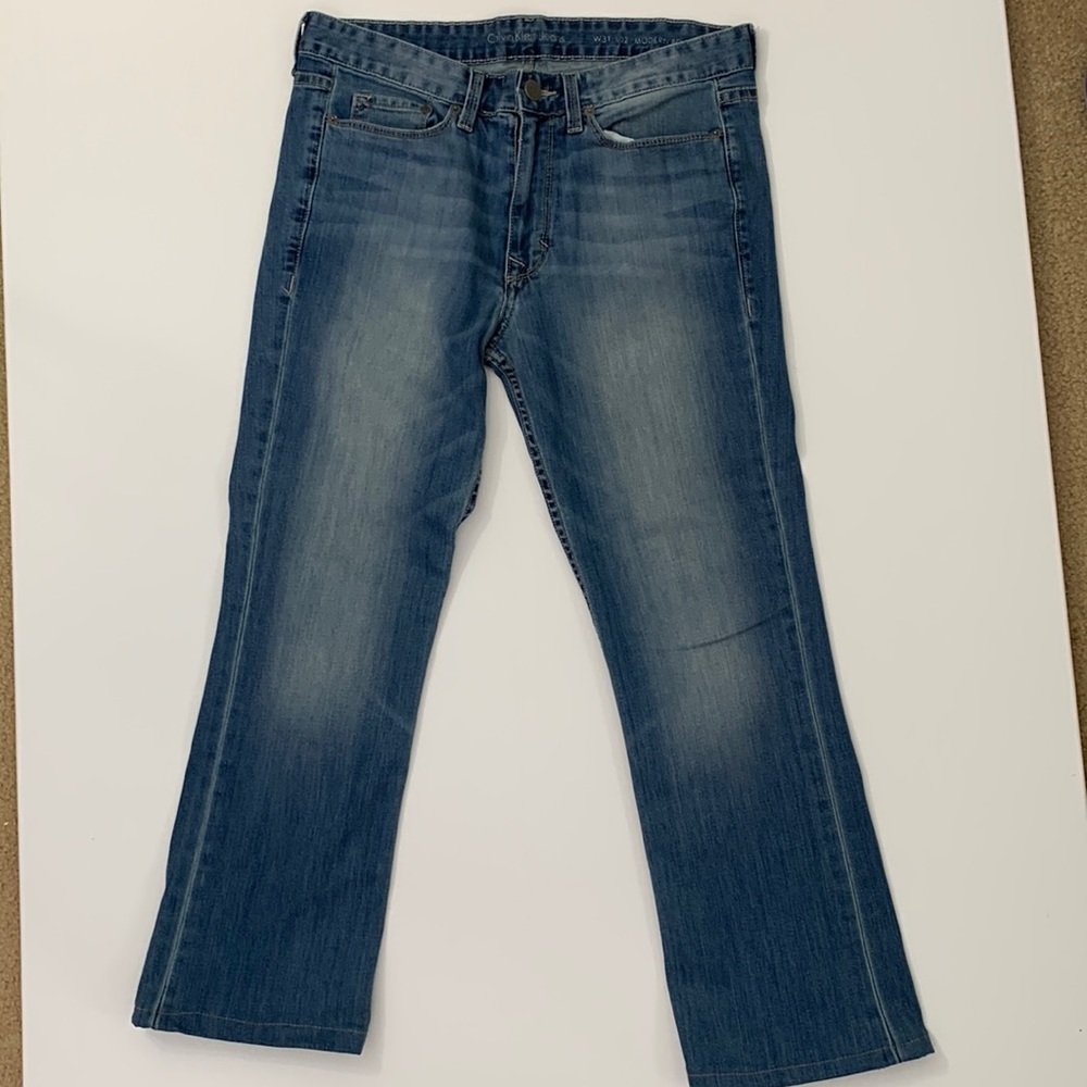 Calvin Klein 31 distressed hemmed to a 26” length
